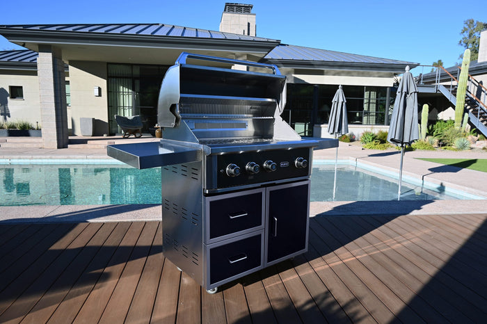 Wildfire Ranch Pro 36-inch grill on a black stainless steel cart beside a pool