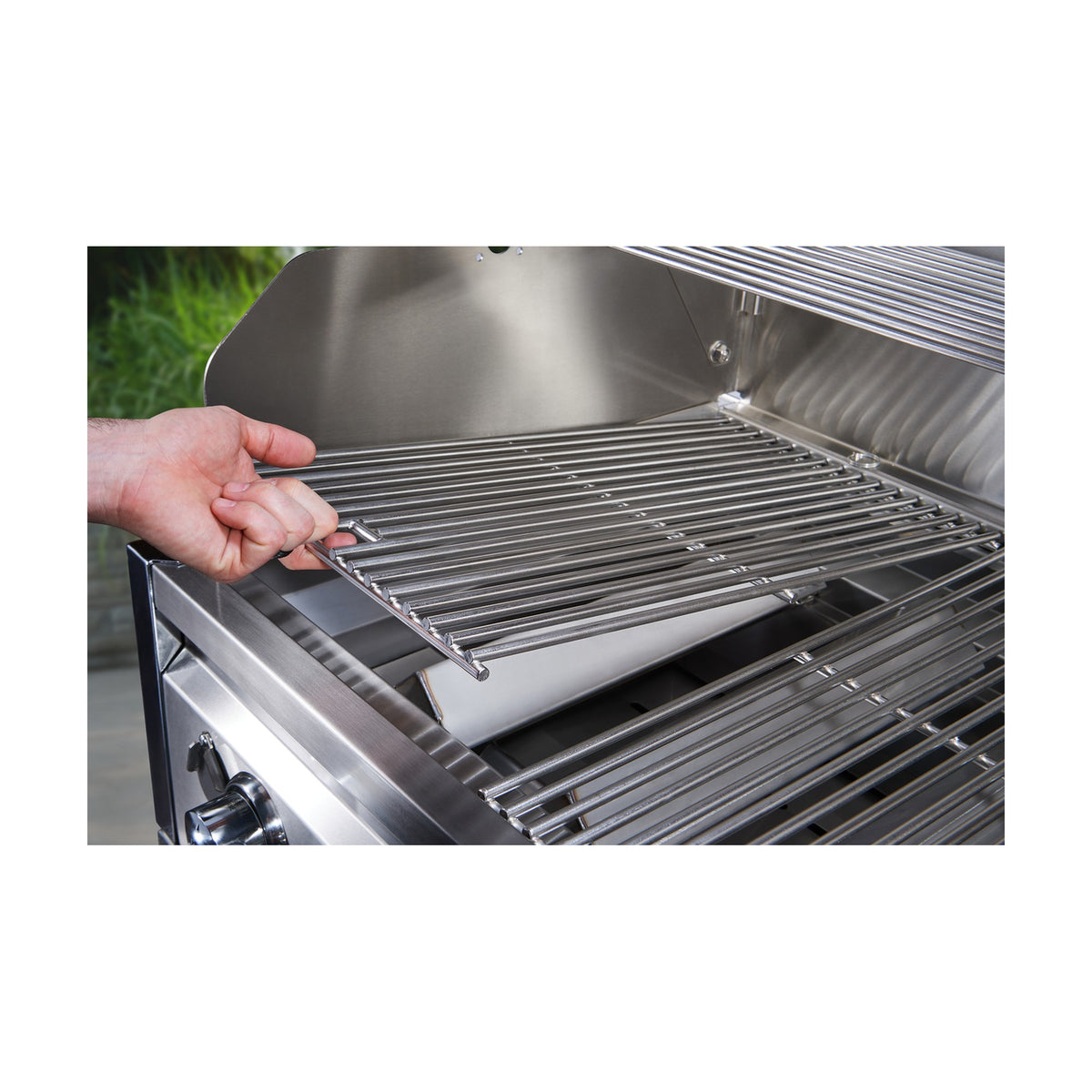 Lifting a Crown Verity stainless steel cooking grate