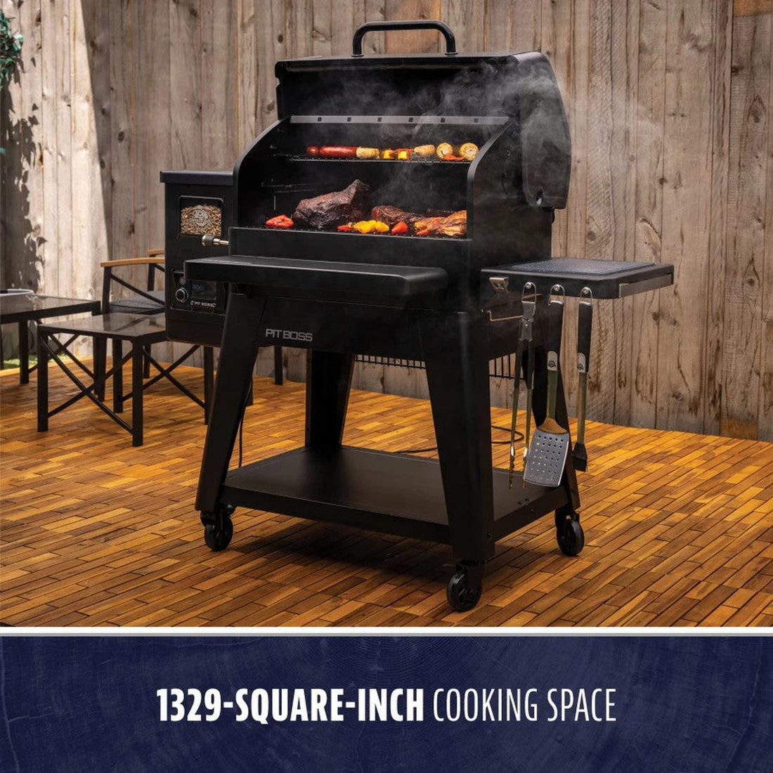 Pit Boss Navigator 1300 pellet grill with meat and vegetables smoking on the grates, on a wood deck