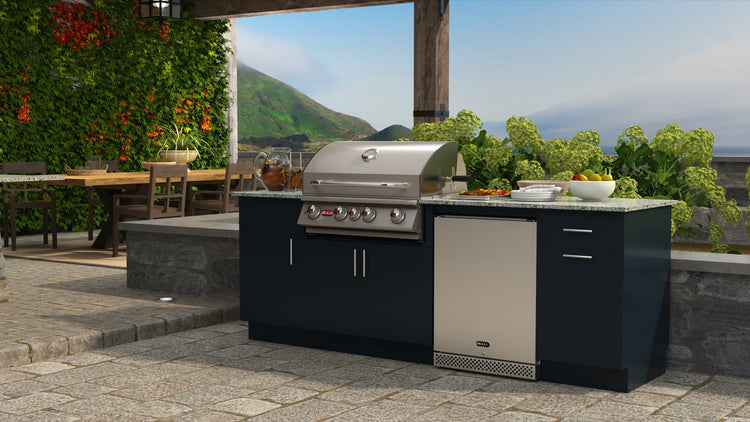Bull Myrtle Beach 8-foot DuraKitchen island with an Angus grill, stainless steel refrigerator and blue HDPE cabinets on a stone patio