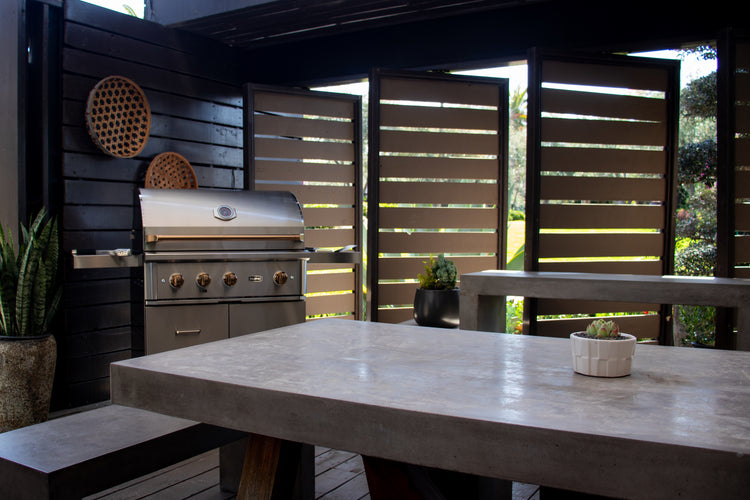 Stainless grill cart with cover, outdoor kitchen setting