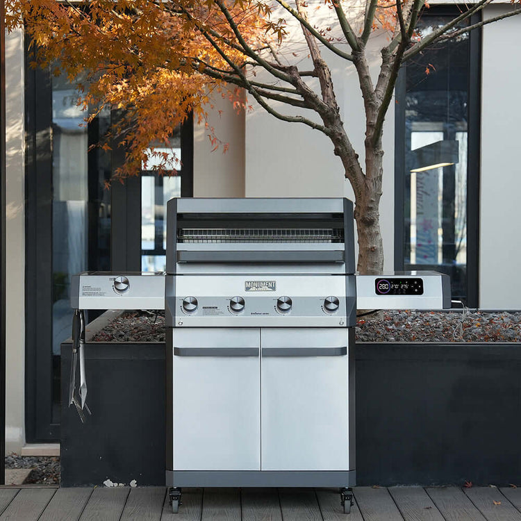 Monument Grills Eminence 405 gas grill on a backyard patio