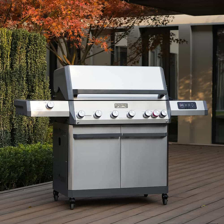 Monument Grills Eminence 605 stainless gas grill on a wood deck