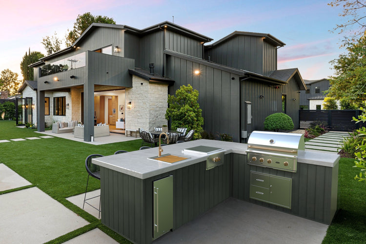 Wildfire built-in gas griddle in an outdoor kitchen setting