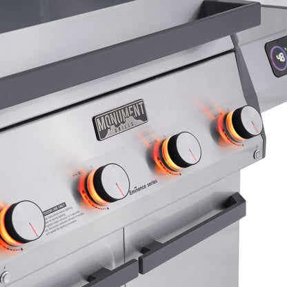 Monument Grills Eminence 405 gas grill, knob lights glowing orange
