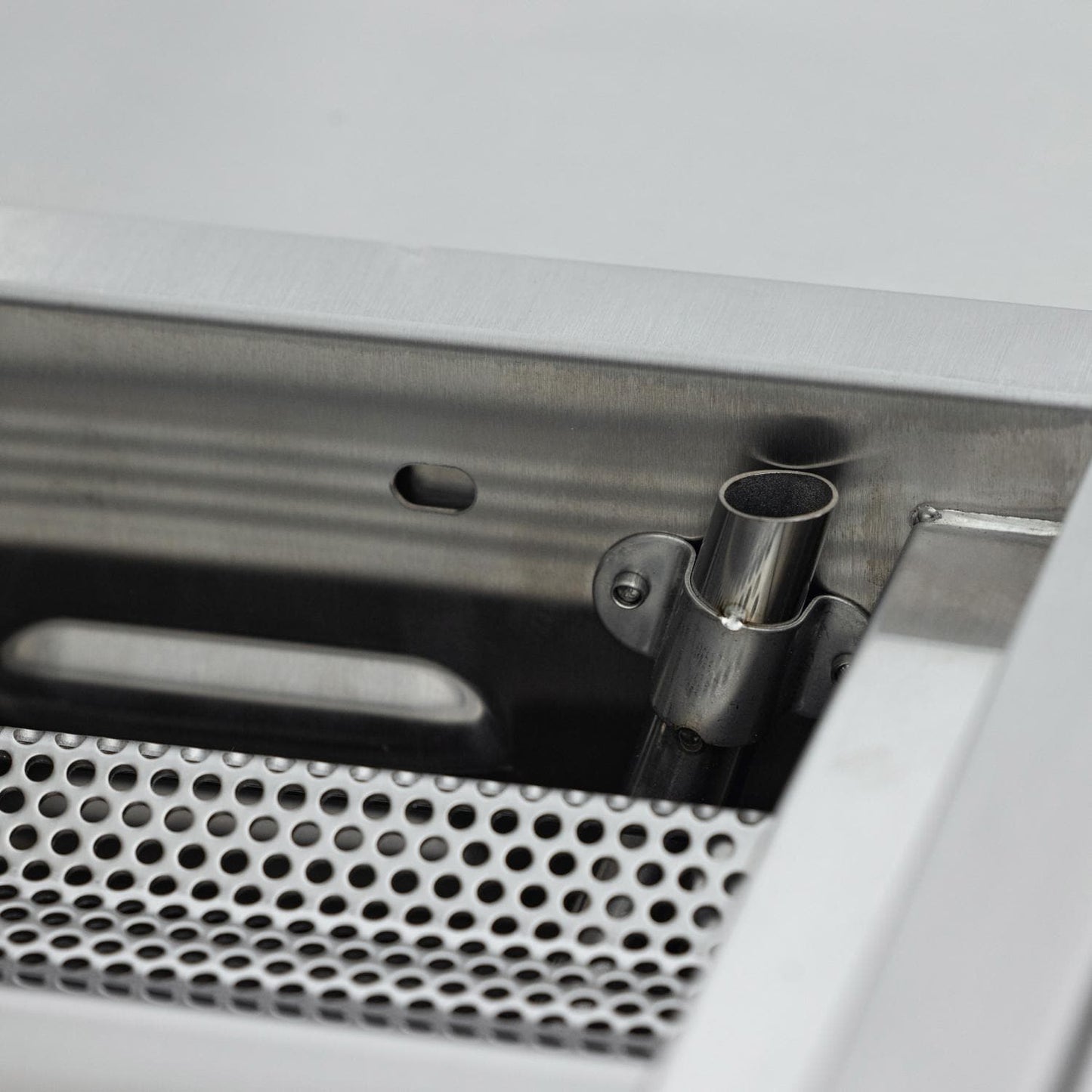 Rotisserie rod support bracket inside the grill
