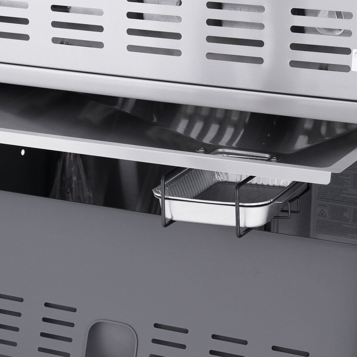 Monument Grills Eminence 405 gas grill, slide-out grease tray