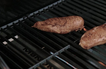 Monument Grills smoker box in use with chicken on the grill