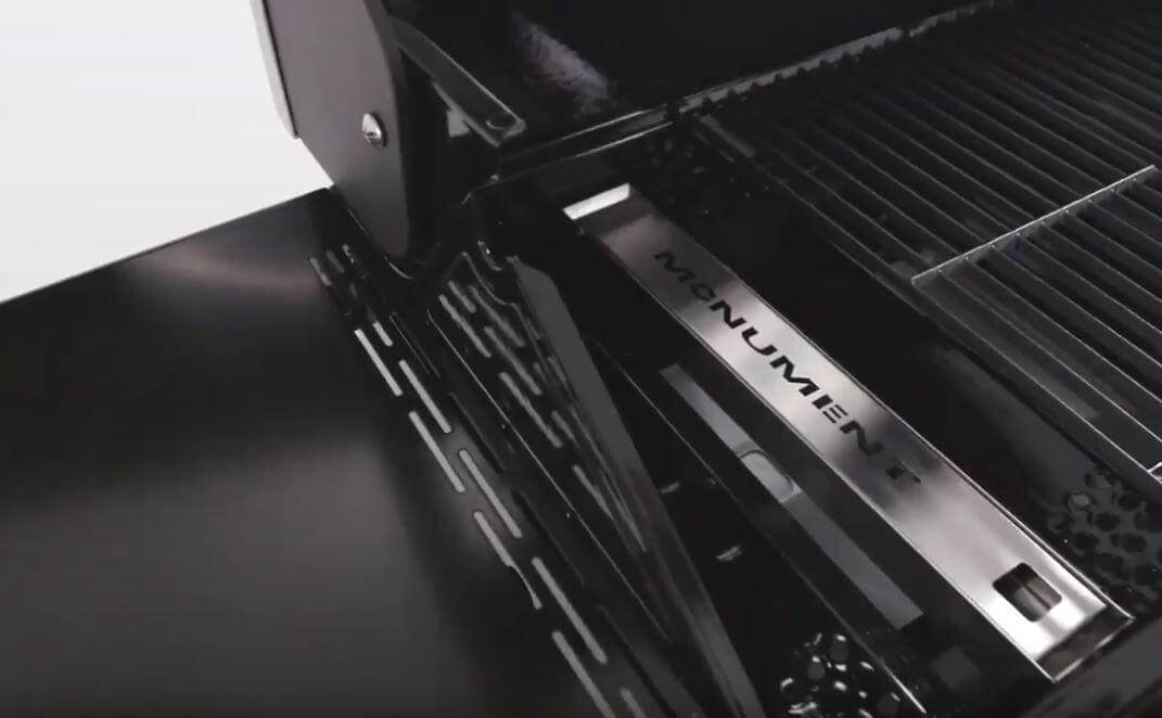 Monument Grills smoker box in a gas grill, close-up