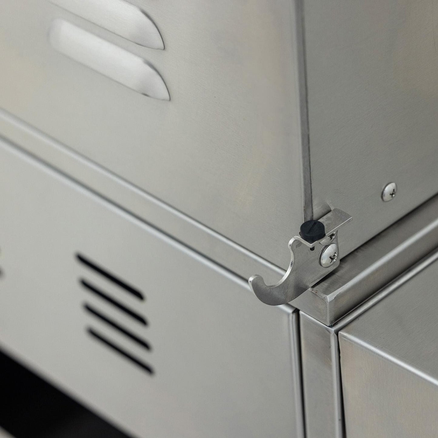 Side-mounted accessory storage bracket on the stainless steel grill cart