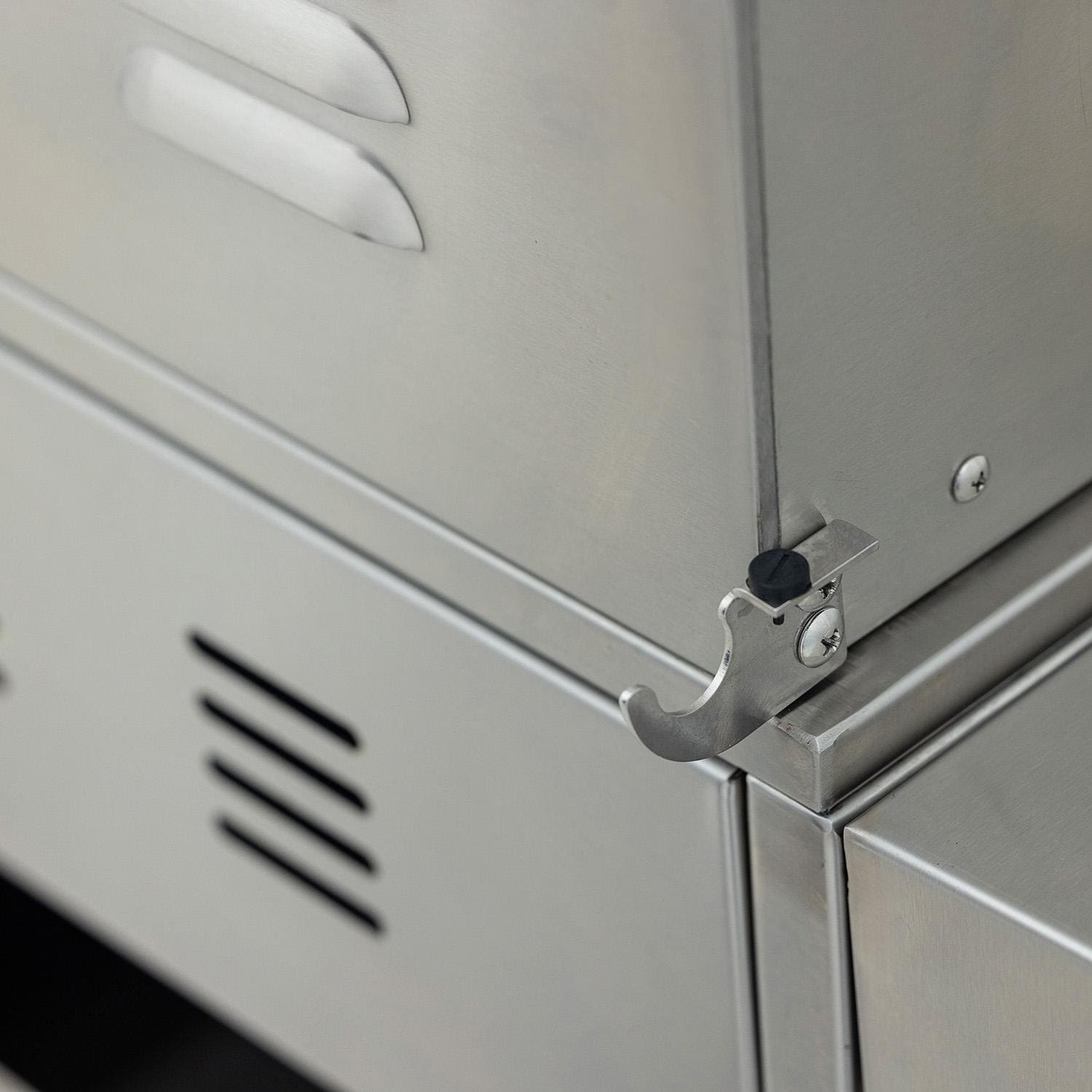 Side-mounted accessory storage bracket on the stainless steel grill cart
