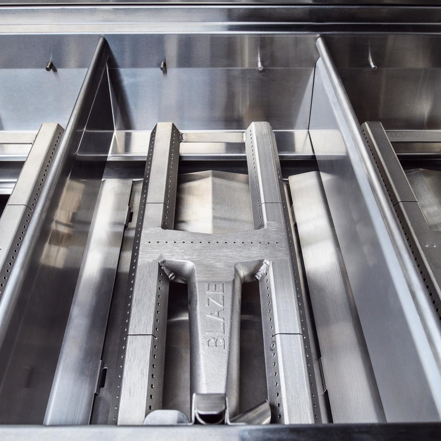 304 cast stainless steel H burner inside the Blaze Professional LUX grill