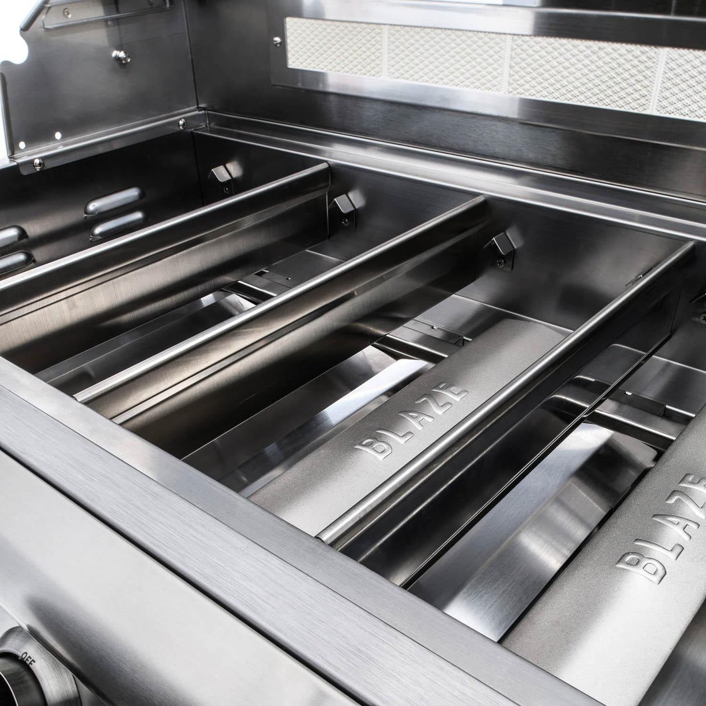 Cast stainless steel burners inside the Blaze LTE+ Marine Grade grill