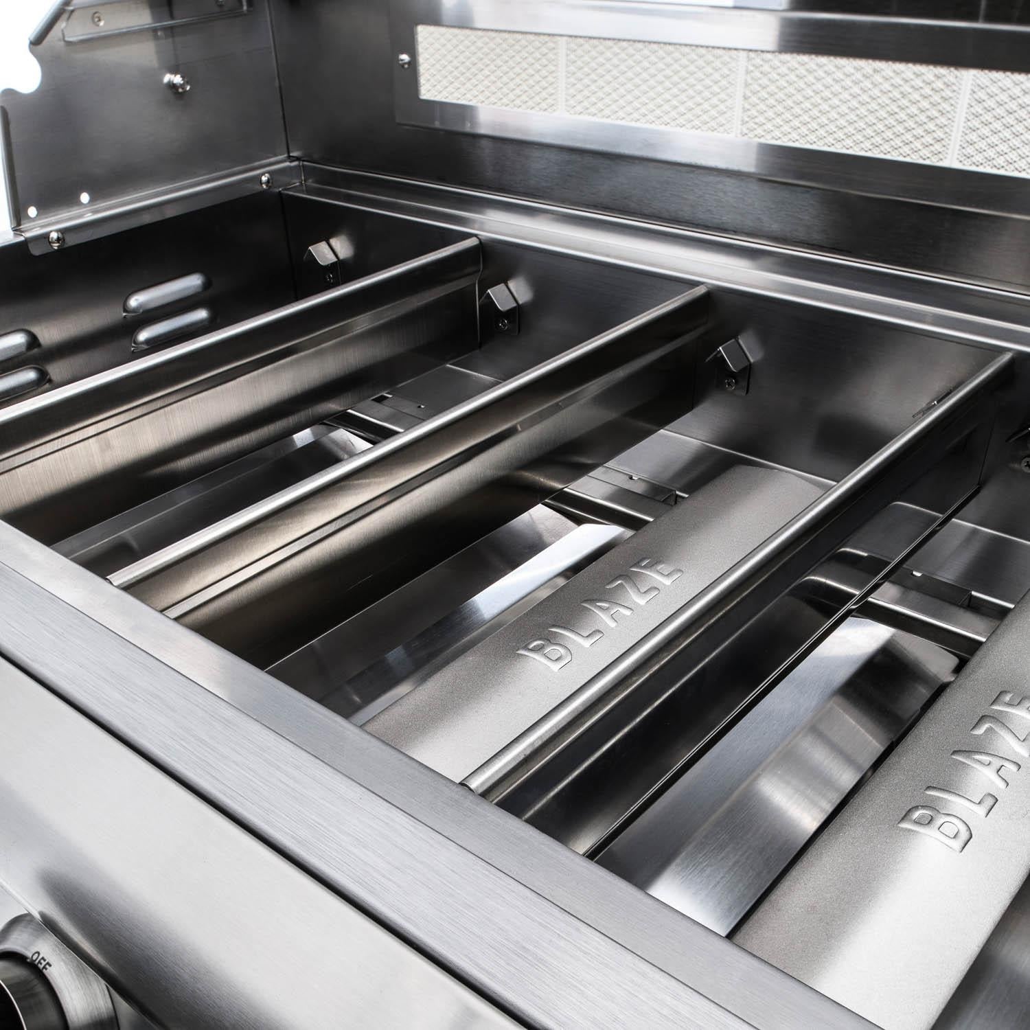 Cast stainless steel burners inside the Blaze LTE+ Marine Grade grill