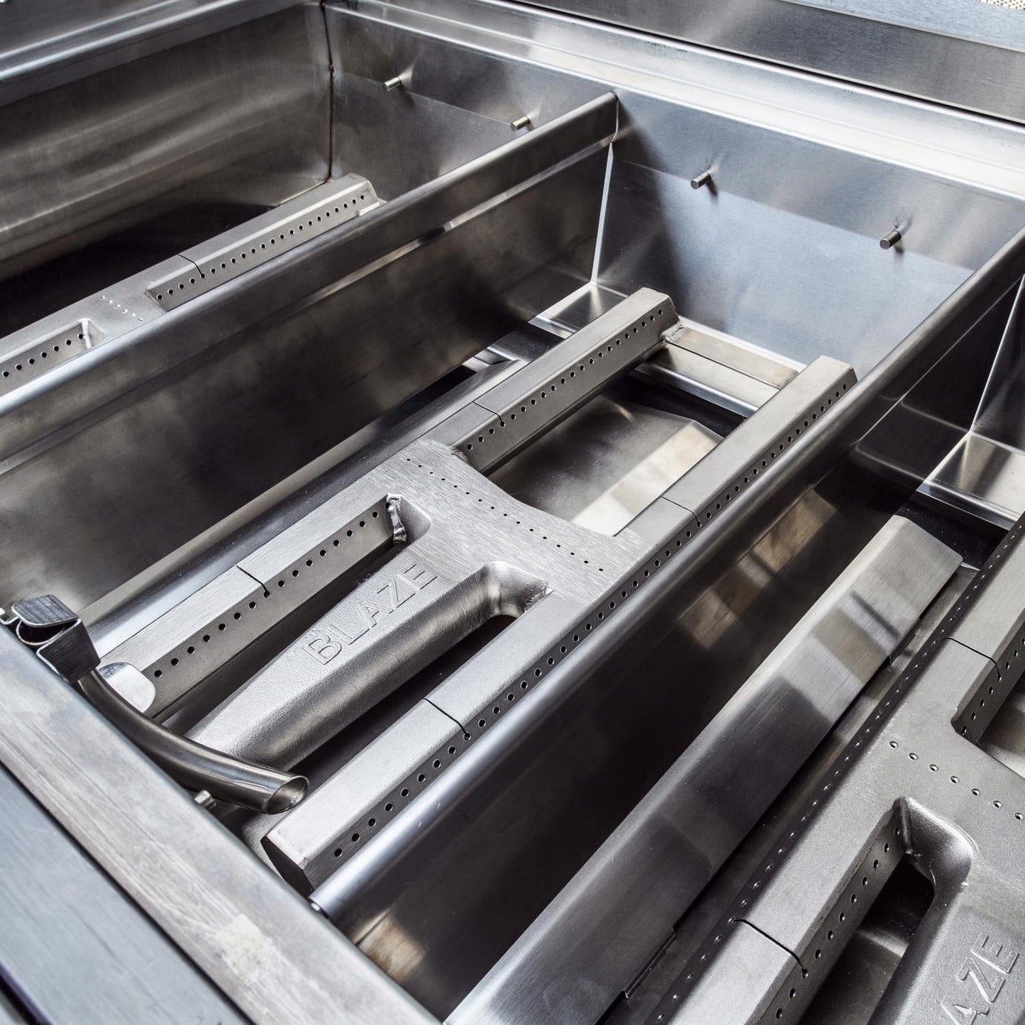 Four H burners and flash-tube ignition system inside the Blaze Professional LUX grill