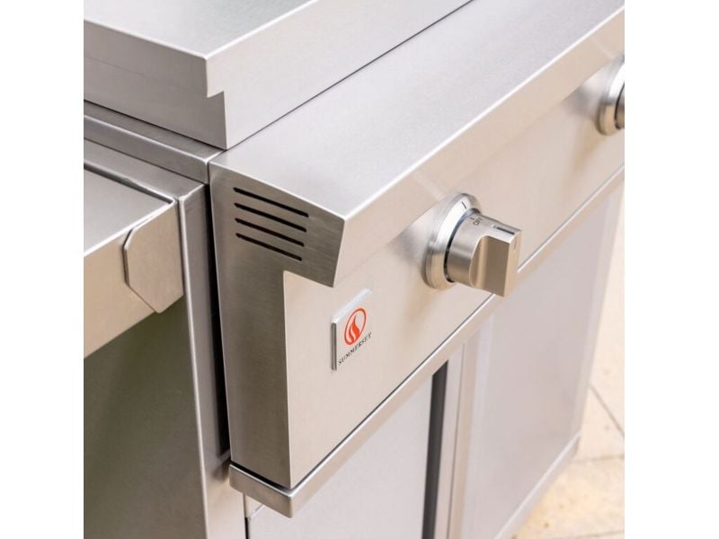 Angled view of the Summerset Griddle Pro stainless steel control panel and side shelf