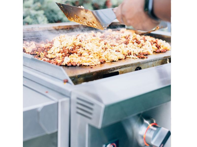 Breakfast cooking on the Summerset Griddle Pro stainless steel flat-top surface