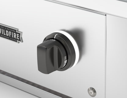 Wildfire replacement knob and base in Chrome Black finish, installed on a stainless steel control panel