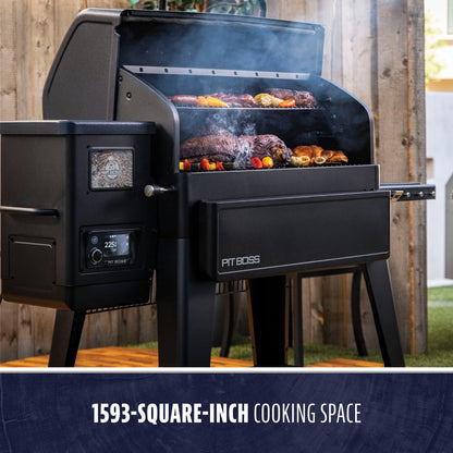 Pit Boss Navigator 1600 smoking food on a backyard patio, 1,593 square inches of cooking space