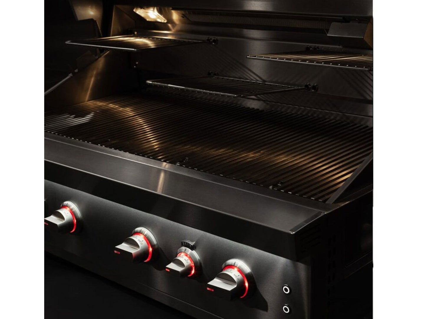 Open Summerset Quest gas grill with interior lights and cooking grates