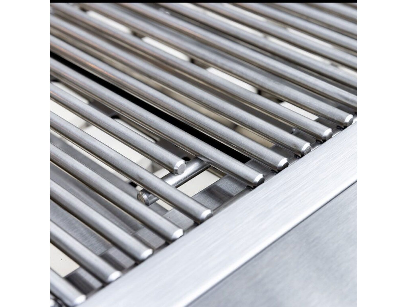 Cast stainless steel main burners inside a Summerset Sizzler Pro gas grill