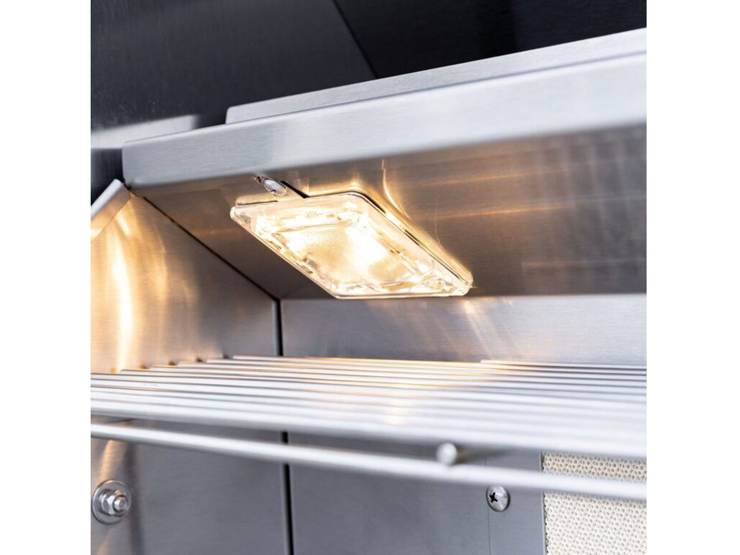 Easy-clean briquette system inside a Summerset Sizzler Pro gas grill