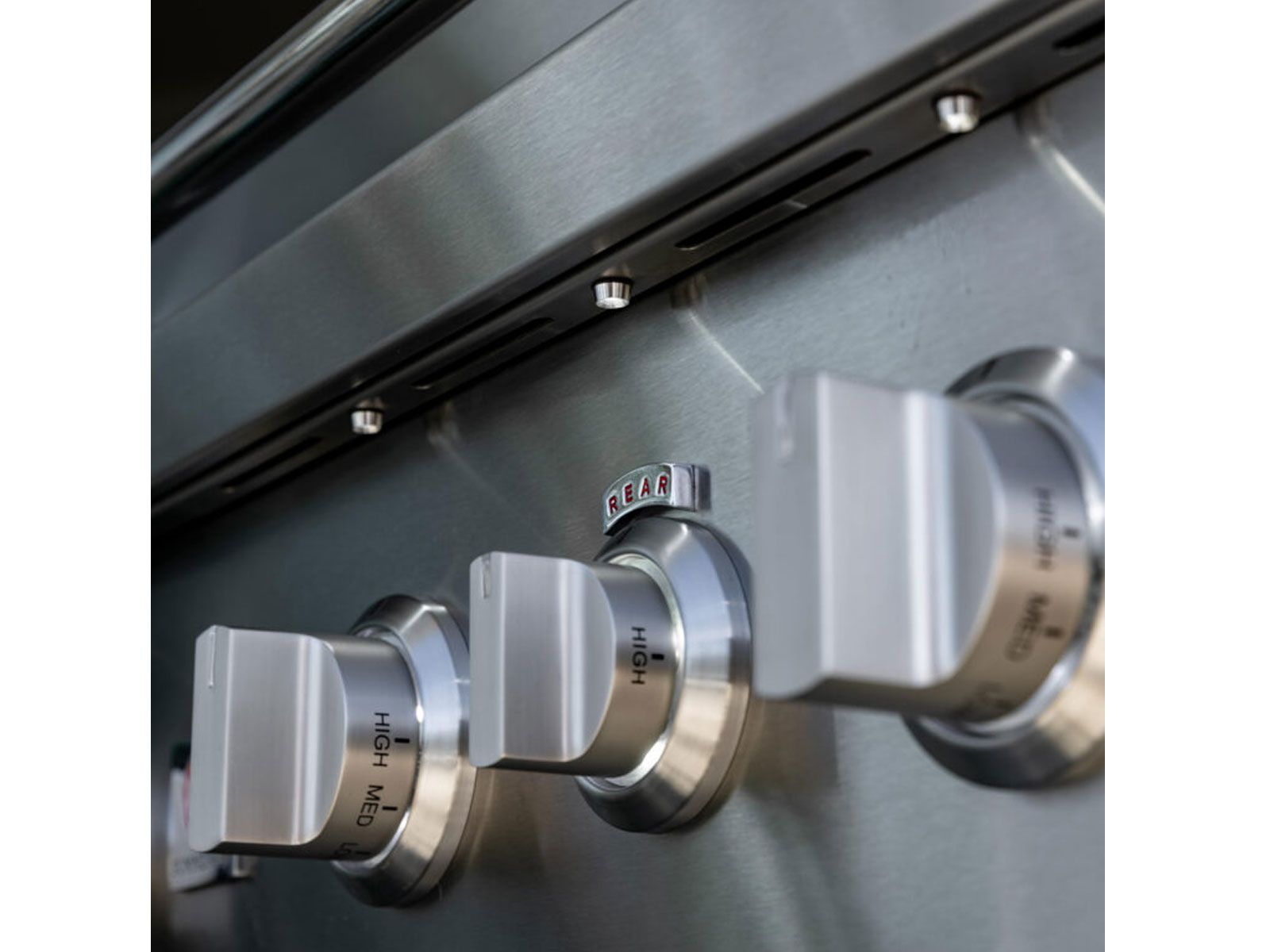 Illuminated stainless steel control knobs on a Summerset TRL Pro gas grill